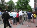 Crowd gathers on Wilson Boulevard to try to catch a glimpse of President Obama
