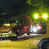 A tow truck hauls away the stolen SUV A tow truck hauls away the stolen SUV