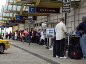 Long line to check in outside Terminal C at Regan National Airport, which has been hit by a power outage
