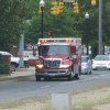 An ambulance transports a victim of Monday's pickup truck vs. Metrobus crash