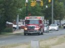 An ambulance transports a victim of Monday's pickup truck vs. Metrobus crash