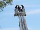 A tree trimmer is rescued by the Arlington Fire Department