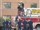 A tree trimmer is rescued by the Arlington Fire Department