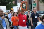 Pro-immigrant demonstrators march to a rally in Courthouse