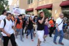Pro-immigrant demonstrators march to a rally in Courthouse