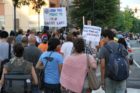 Pro-immigrant demonstrators march to a rally in Courthouse