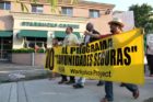 Pro-immigrant demonstrators march to a rally in Courthouse