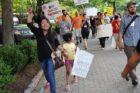 Pro-immigrant demonstrators march to a rally in Courthouse