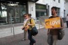 Pro-immigrant demonstrators march to a rally in Courthouse