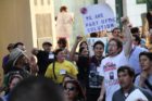 Pro-immigrant demonstrators march to a rally in Courthouse