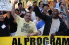 Pro-immigrant demonstrators march to a rally in Courthouse