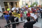 Pro-immigrant demonstrators march to a rally in Courthouse
