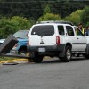 A car struck and toppled a light pole in a 7-Eleven parking lot