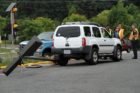 A car struck and toppled a light pole in a 7-Eleven parking lot