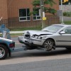 A car struck and toppled a light pole in a 7-Eleven parking lot