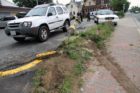 A car struck and toppled a light pole in a 7-Eleven parking lot
