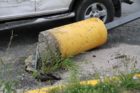 A car struck and toppled a light pole in a 7-Eleven parking lot