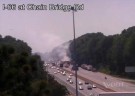A truck full of hay burns along westbound I-66