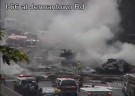 A truck full of hay burns along westbound I-66