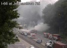 A truck full of hay burns along westbound I-66