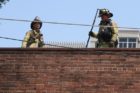 Firefighters battle an apartment fire in Ft. Myer Heights