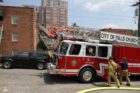 Firefighters battle an apartment fire in Ft. Myer Heights