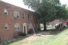 Firefighters battle an apartment fire in Ft. Myer Heights