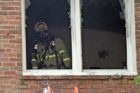 Firefighters battle an apartment fire in Ft. Myer Heights