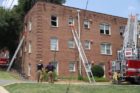 Firefighters battle an apartment fire in Ft. Myer Heights