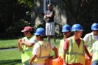 A residents watches construction on Arlington Ridge Road
