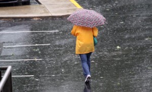 Woman walks through the wind and rain caused by Hurricane Irene (file photo)
