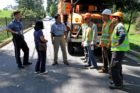 County Board member and Acting County Manager Marsha Allgeier talk to tree workers at Rock Spring Road and N. Wakefield Street