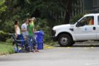 Residents watch the cleanup at N. Quantico Street and 18th Street