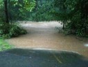 The exit off of W&OD to Greenbriar. The trail defends 4-5 feet to go over a little bridge. The water is right up to W&OD level. (courtesy photo)