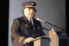 A fire department official speaks at Arlington's 9/11 anniversary ceremony