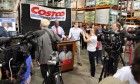 Republican presidential candidate Herman Cain signing books at the Pentagon City Costco