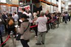 Republican presidential candidate Herman Cain signing books at the Pentagon City Costco