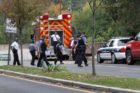 Bomb squad members and police officers investigate suspicious packages near I-66 and the Patrick Henry Drive overpass
