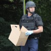 Bomb squad members and police officers investigate suspicious packages near I-66 and the Patrick Henry Drive overpass Bomb squad members and police officers investigate suspicious packages near I-66 and the Patrick Henry Drive overpass