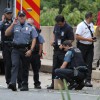 Bomb squad members and police officers investigate suspicious packages near I-66 and the Patrick Henry Drive overpass Bomb squad members and police officers investigate suspicious packages near I-66 and the Patrick Henry Drive overpass