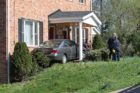 A car crashed into the front porch of an apartment building in the Columbia Heights West neighborhood