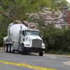 A cement truck backed into two utility poles on 16th Street N.