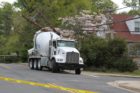 A cement truck backed into two utility poles on 16th Street N.