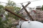 A cement truck backed into two utility poles on 16th Street N.