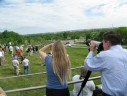 Spectators at the Air Force Memorial watching the space shuttle Discovery