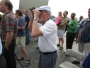 Spectators at the Air Force Memorial watching the space shuttle Discovery