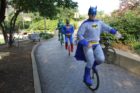 Unicyclists provide entertainment at the Bike to Work Day pit stop in Rosslyn