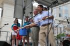 County Board member Walter Tejada displays a hockey stick that was raffled off at Taste of Arlington 2012