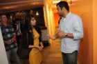 Actor Kal Penn and former White House official Aneesh Chopra talk with Obama supporters in Arlington