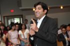 Actor Kal Penn and former White House official Aneesh Chopra talk with Obama supporters in Arlington
